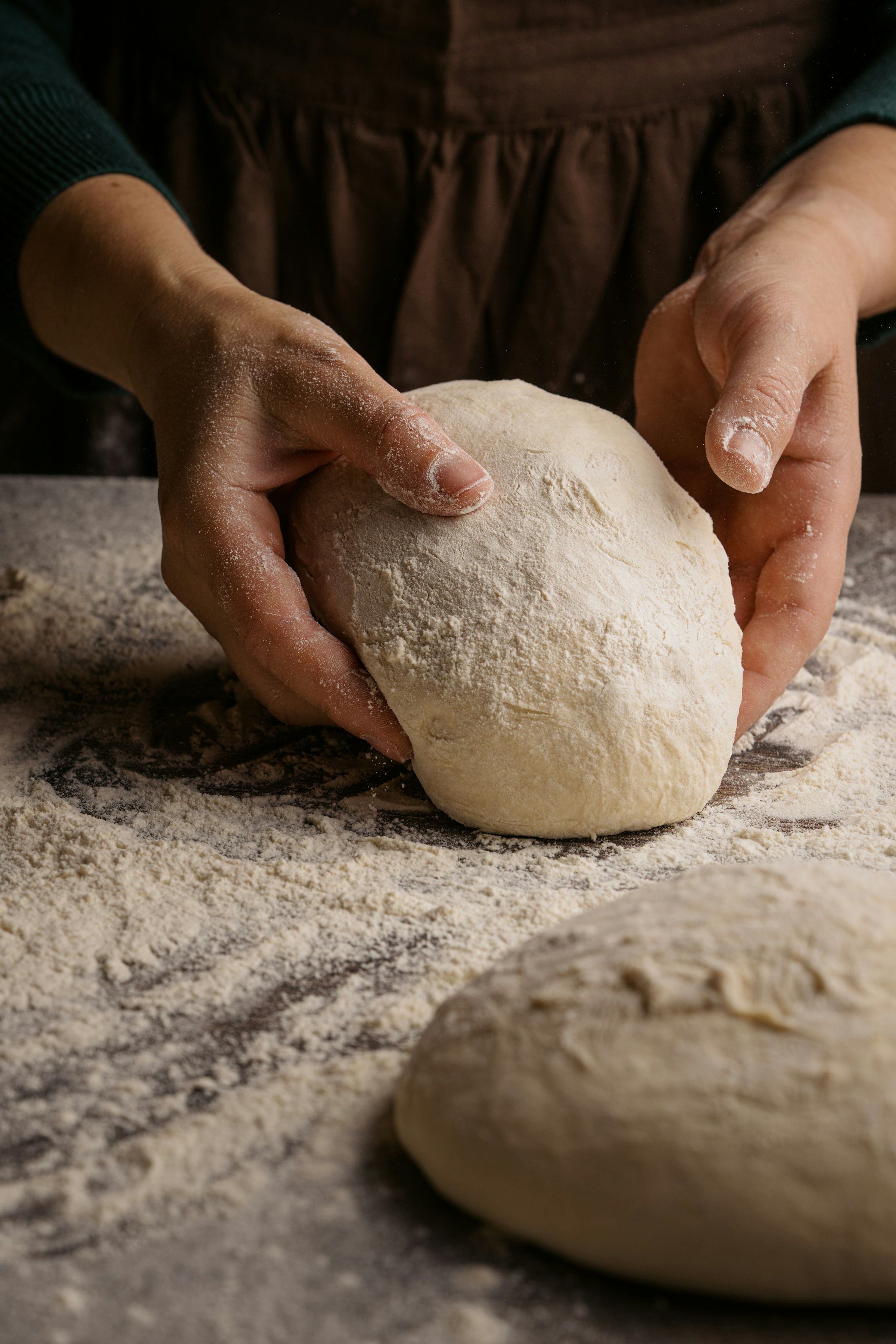 Baker kneading sourdough dough